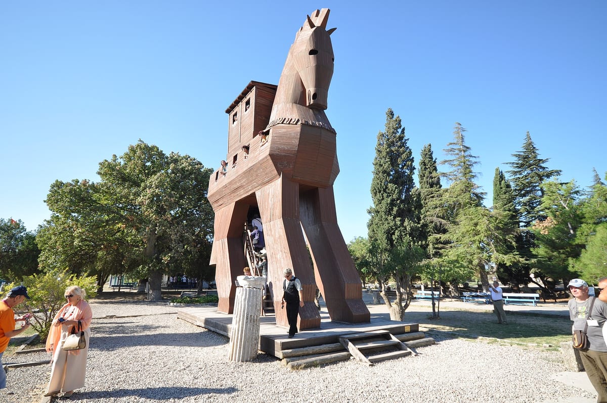 Troy archaeological site with the wooden horse replica in the distance